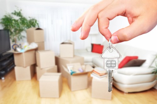 Professional movers loading boxes and furniture for urgent removals in Clapton