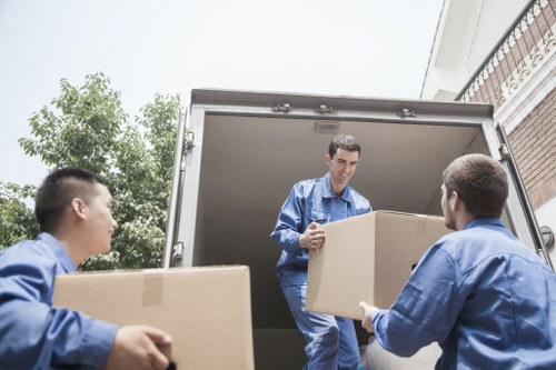 Clapton removals team handling household furniture safely