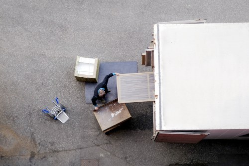 Furniture removals team working in a Clapton street with local property access challenges