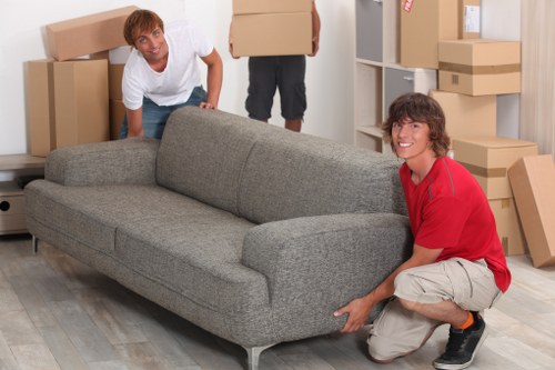 Local removals van loading household items for a move around Clapton