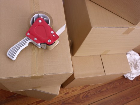 Removal team handling furniture during a Clapton house move