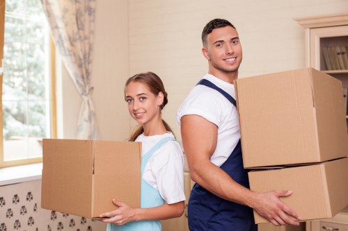 Professional movers loading furniture into a truck in Clapton