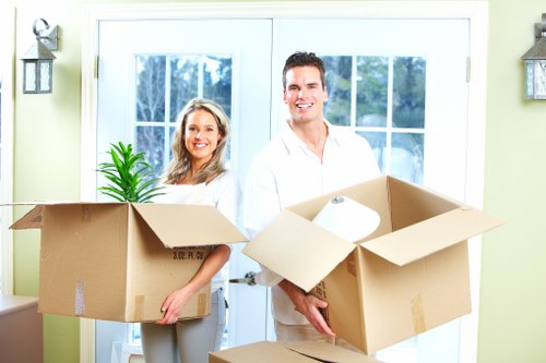 Professional Clapton movers packing boxes for relocation
