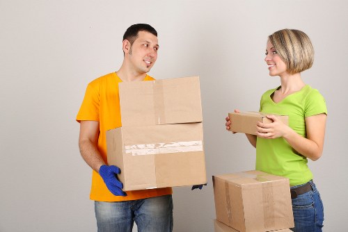 Staff preparing desks and IT equipment for an office move in Clapton