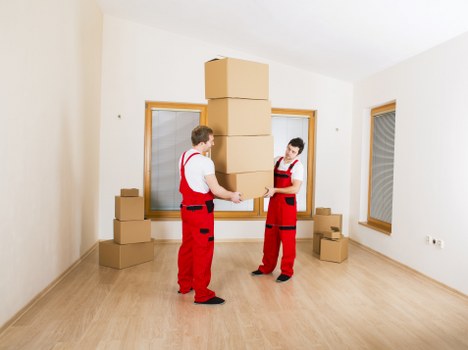 Unpacking boxes in a new Clapton home after relocation